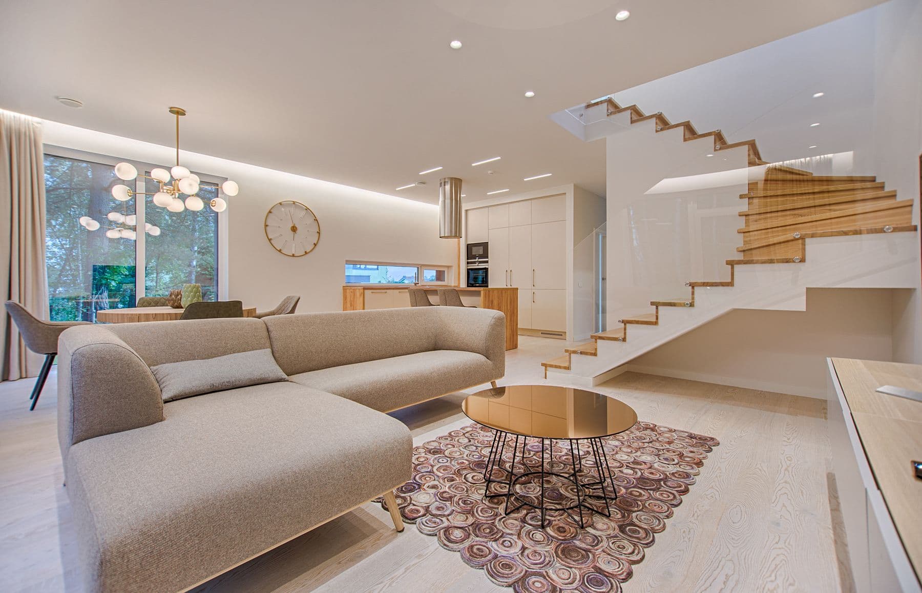 Interior walkthrough — stair, living, and dining as one volume